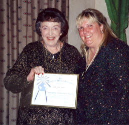 Jackie, posing with daughter Karen, holding SWG's Outstanding Achievement Award, Tuson, Arizona 2002
